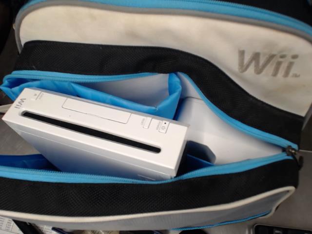 Wii + sac + 4man + tc + jeux