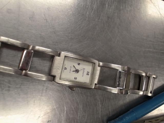 Montre argent aiguil or