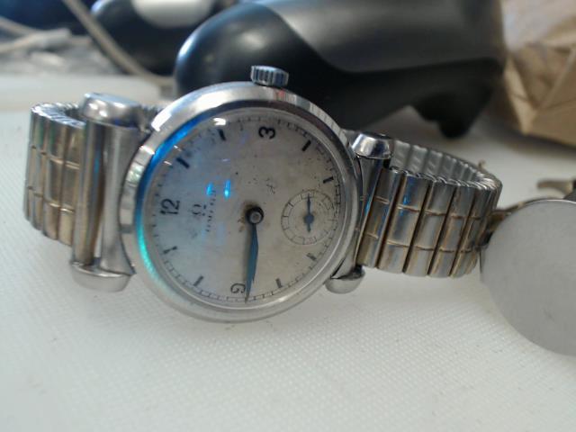 Montre omega mecanic 1934