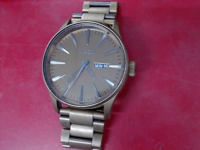 Montre nixon stainless stess cuivre