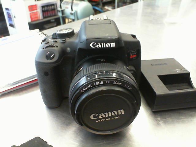 Canon rebel t6i + 50mm lens + charg