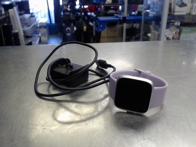 Fitbit mauve rose avec chargeur