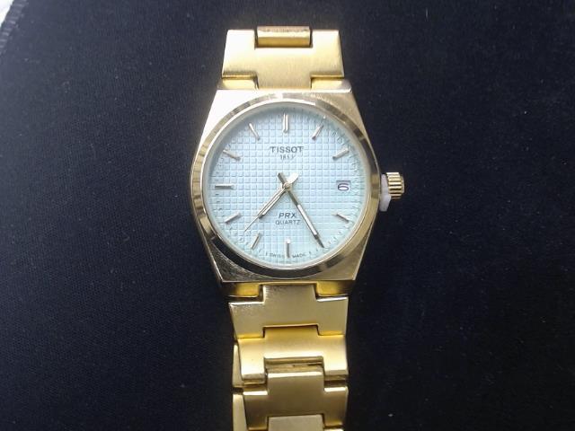 Tissot gold watch blue face