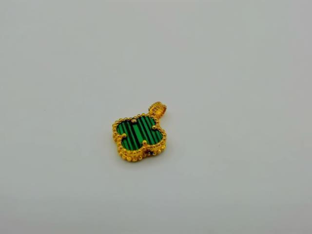 BRELOQUE EN OR 18KT