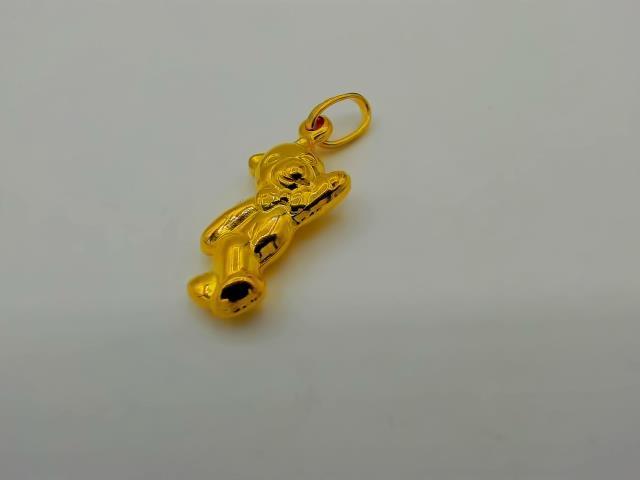 BRELOQUE EN OR 18KT