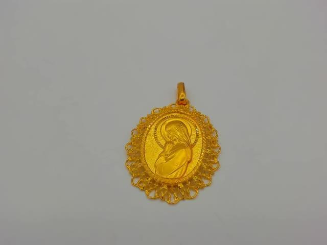 BRELOQUE EN OR 18KT