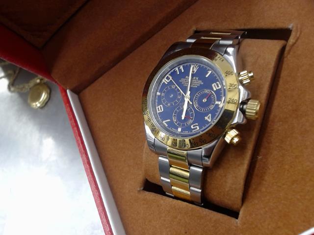 Replique de rolex daytona argent gold