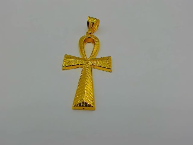 BRELOQUE EN  OR 10KT NEW