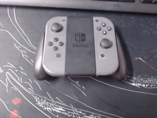Joycon gris nintendo avec manette