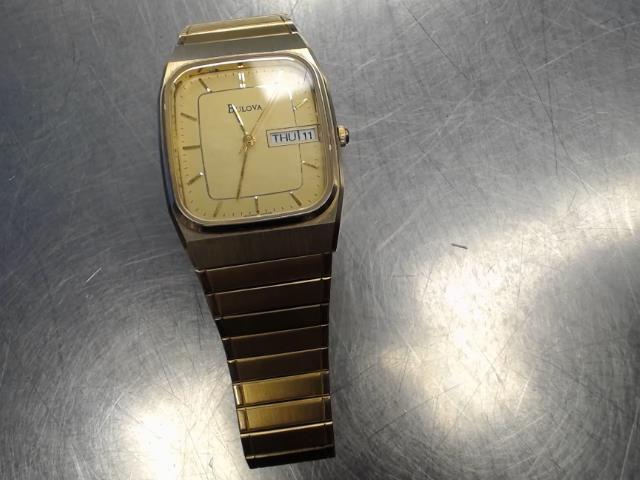 Bulova stainless steel day date gold