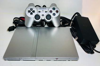 Ps2 slim silver avec manette originale