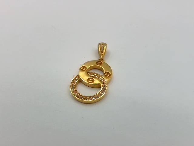 BRELOQUE EN OR 18KT