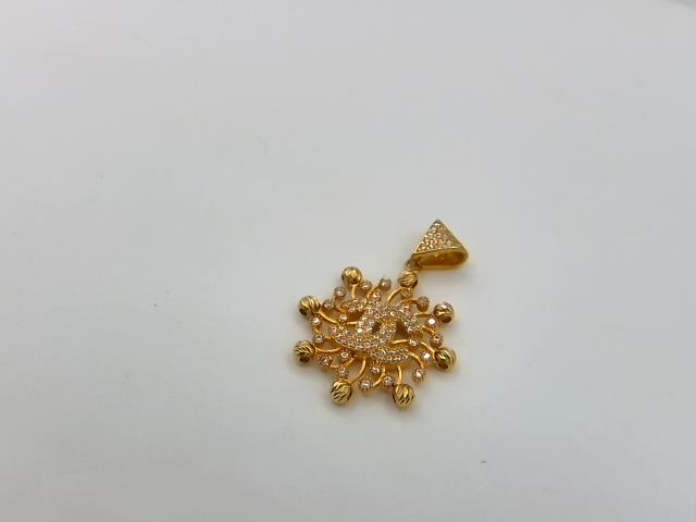 BRELOQUE EN OR 18KT