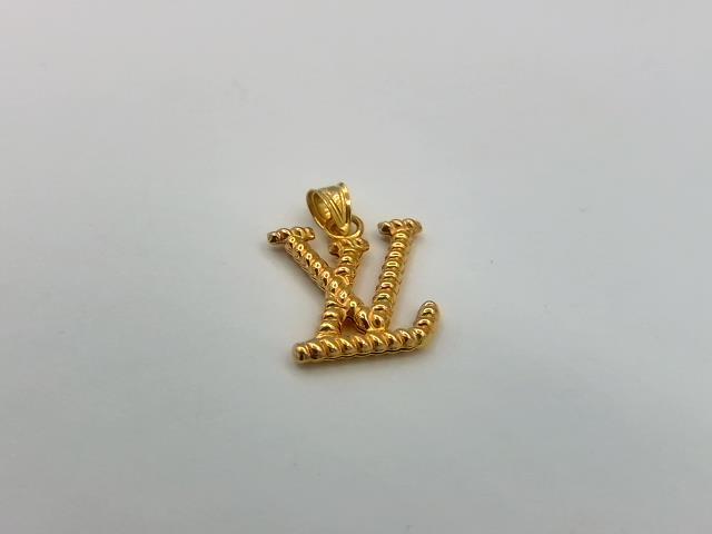 BRELOQUE EN OR 18KT