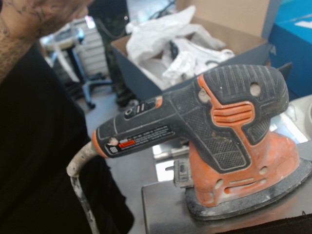Black and orange sander