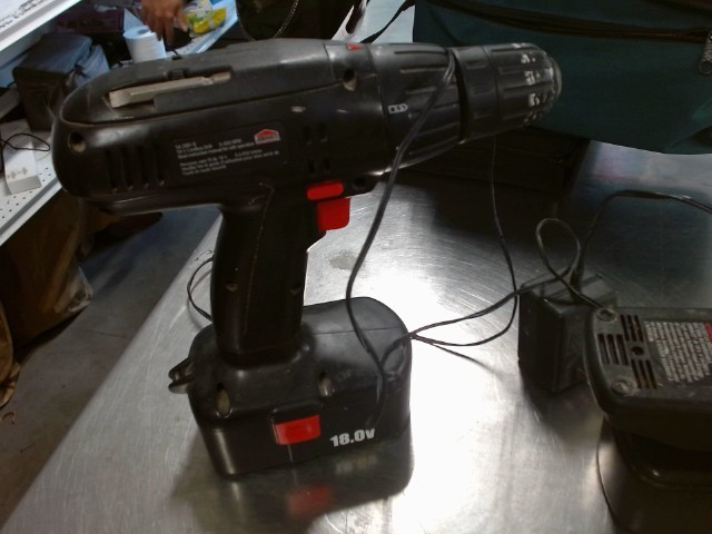 Cordless drill with two battery packs