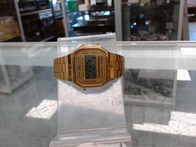 Montre casio fini en or usager