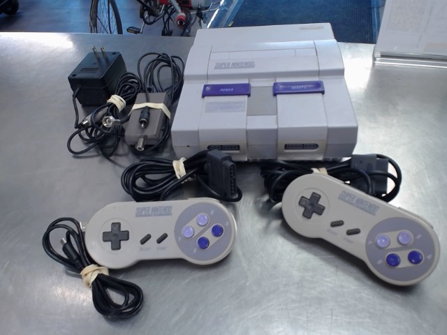 Console snes+2mans + fils