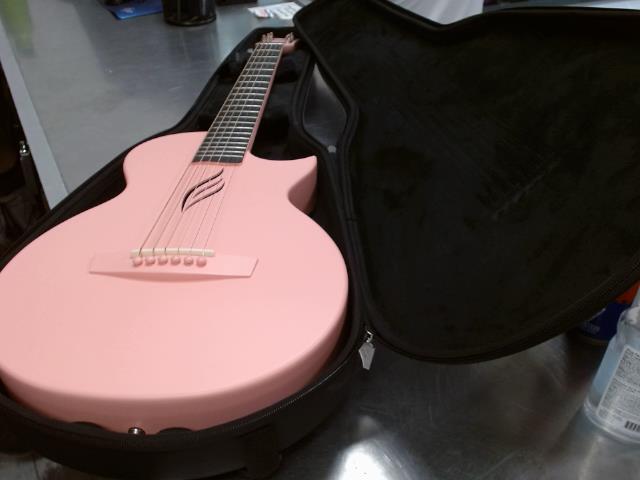 Pink carbon fibe acoustic guitar
