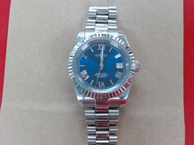 Montre seiko grise et bleue automatique