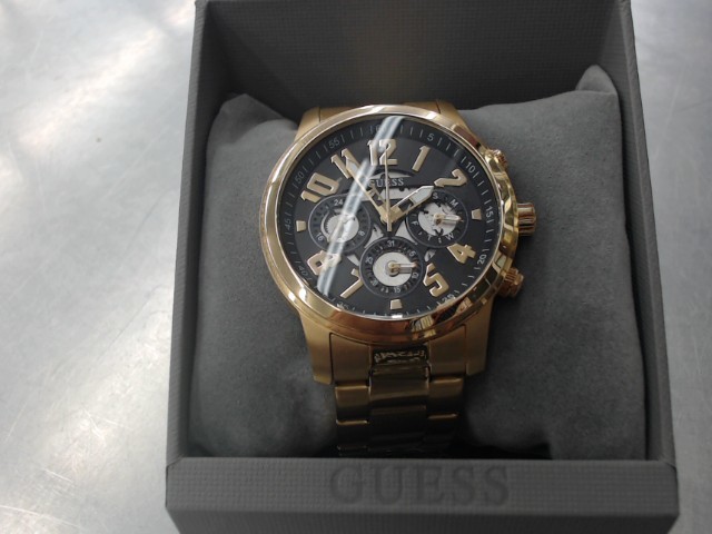 Montre guess couleur or 4 cadrans propre