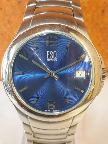 Montre quatrz esq swiss date/blue dial