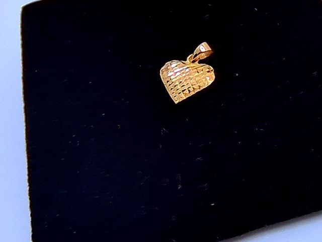 BRELOQUE  EN OR 18KT