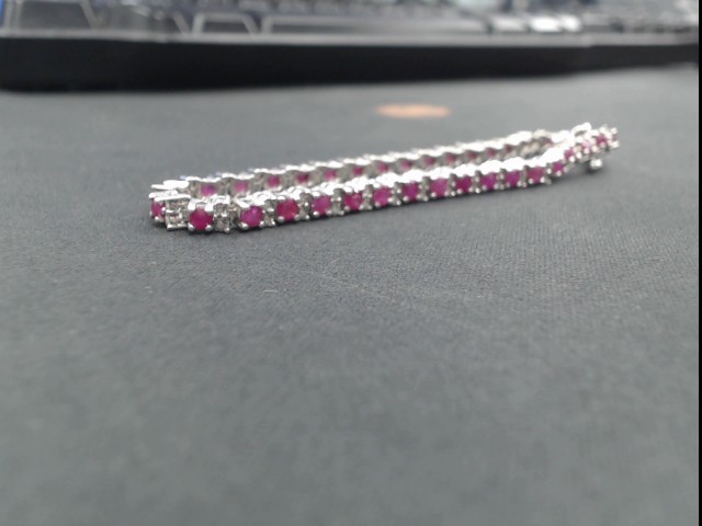 Sterling silver eternity .22ct rubie/dia