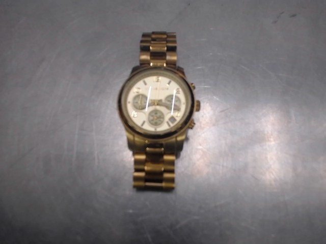 Montre femme mickeal kors couleur gold