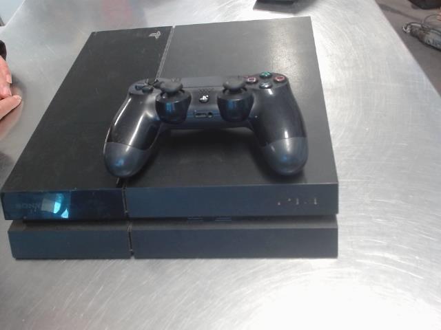 Console noir avec manette et jeux