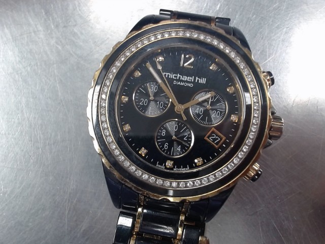 Montre stainless dore/noire + diams