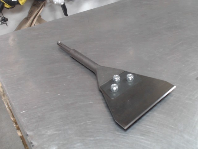 Racleur de couvre plancher