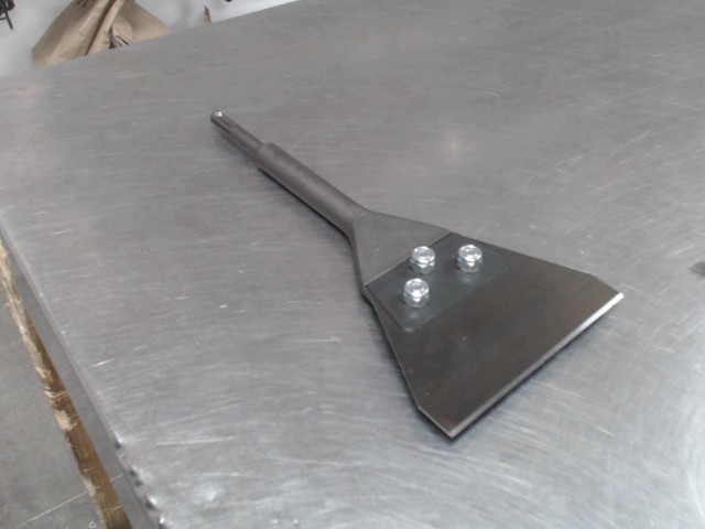 Racleur de couvre plancher