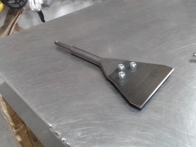 Racleur de couvre plancher