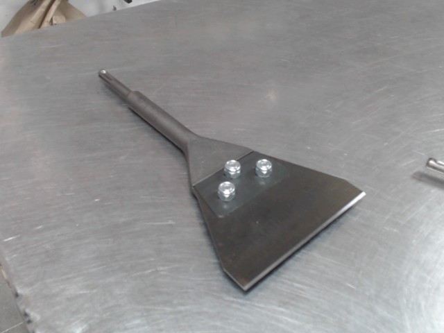 Racleur de couvre plancher