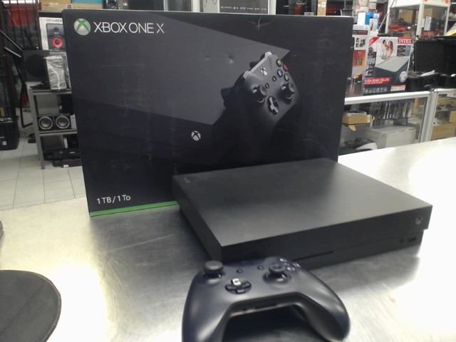 Xbox one x + man + fils