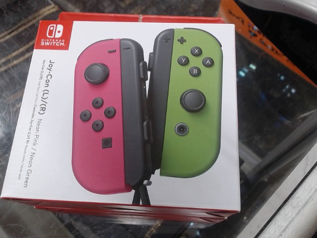 Joycon dans boite rose et vert neon