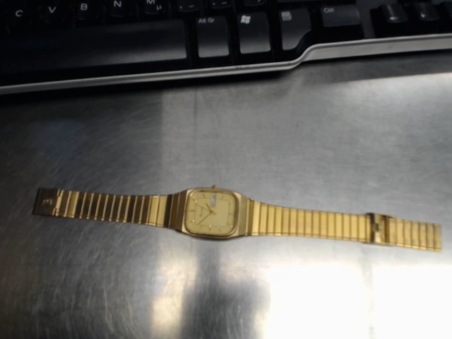 Bulova stainless steel day date gold