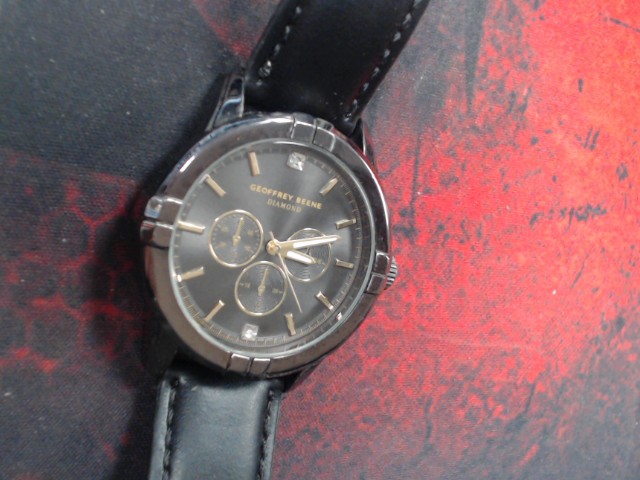 Montre verte et grise en cuir marron