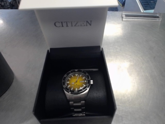 Montre citizen cadrant jaune en boite