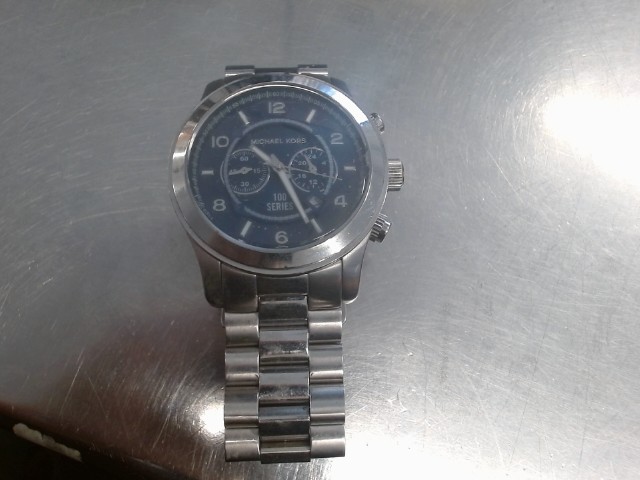 Montre homme mk bon etat