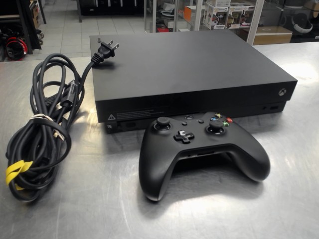 Console xbox one x man+fils