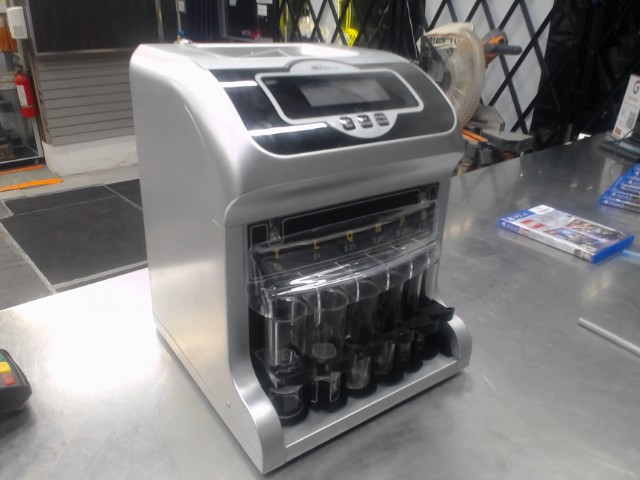 Machine a compter le change electrique