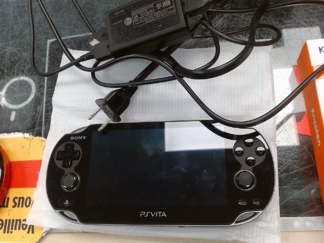 Ps vita avec chargeur mint condition