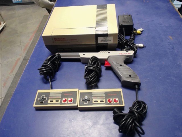 Console 2 manettes et zapper +fils