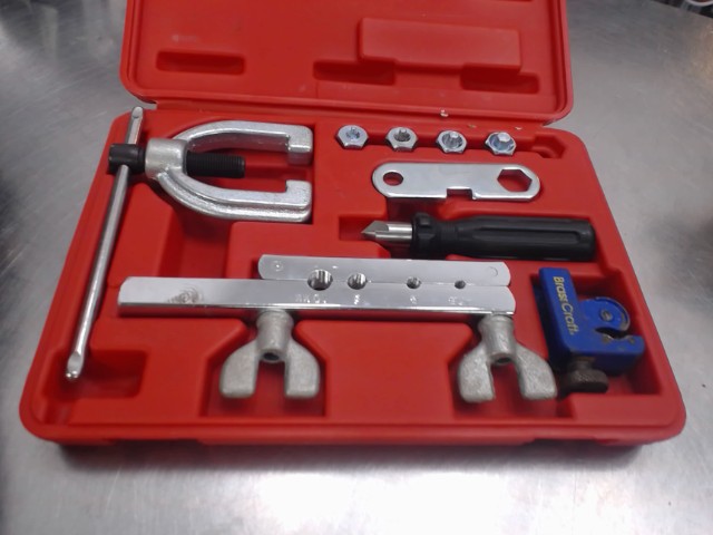 Outil dans case rouge