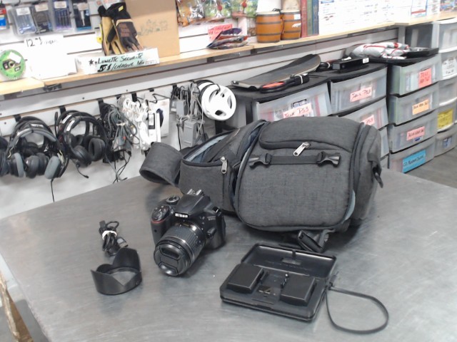 Cam.num+lens 18-55mm+2batt+chargeur+sac