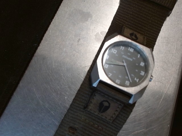 Watch with green dial and army