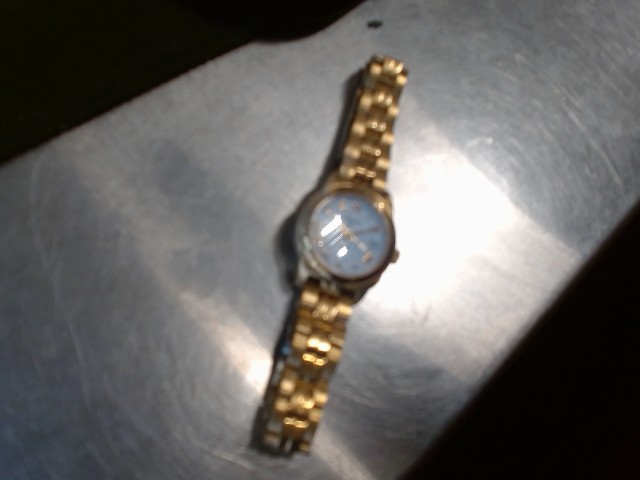 Gold watch with white dial