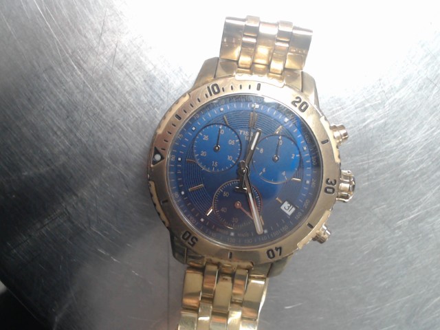 Montre dore tissot fond bleu